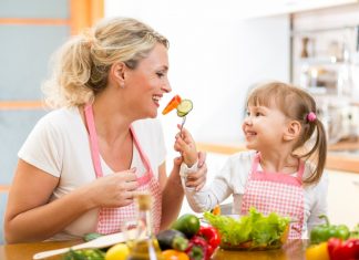 Avoiding Food Hassles With Kids mom-daughter-eating-vegetables-Custom