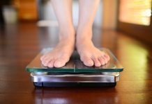 Do you need weightloss coaching? Standing On Weight Scale